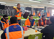 Boris Medina, President-El Abra, speaks to employees about the recycled trays in one of the site’s two cafeterias.