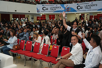 Students at the university engage in the presentation.