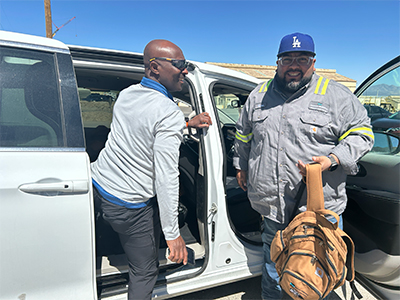 Hamdaweh Sulemana (left) Innovation Engineer II, and Victor Najera, Administrative Assistant-MIS, arrive for work at Sierrita in a company vanpool. 