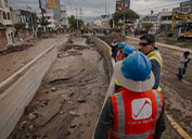 Crews from Cerro Verde survey the damage to streets after recent floods.